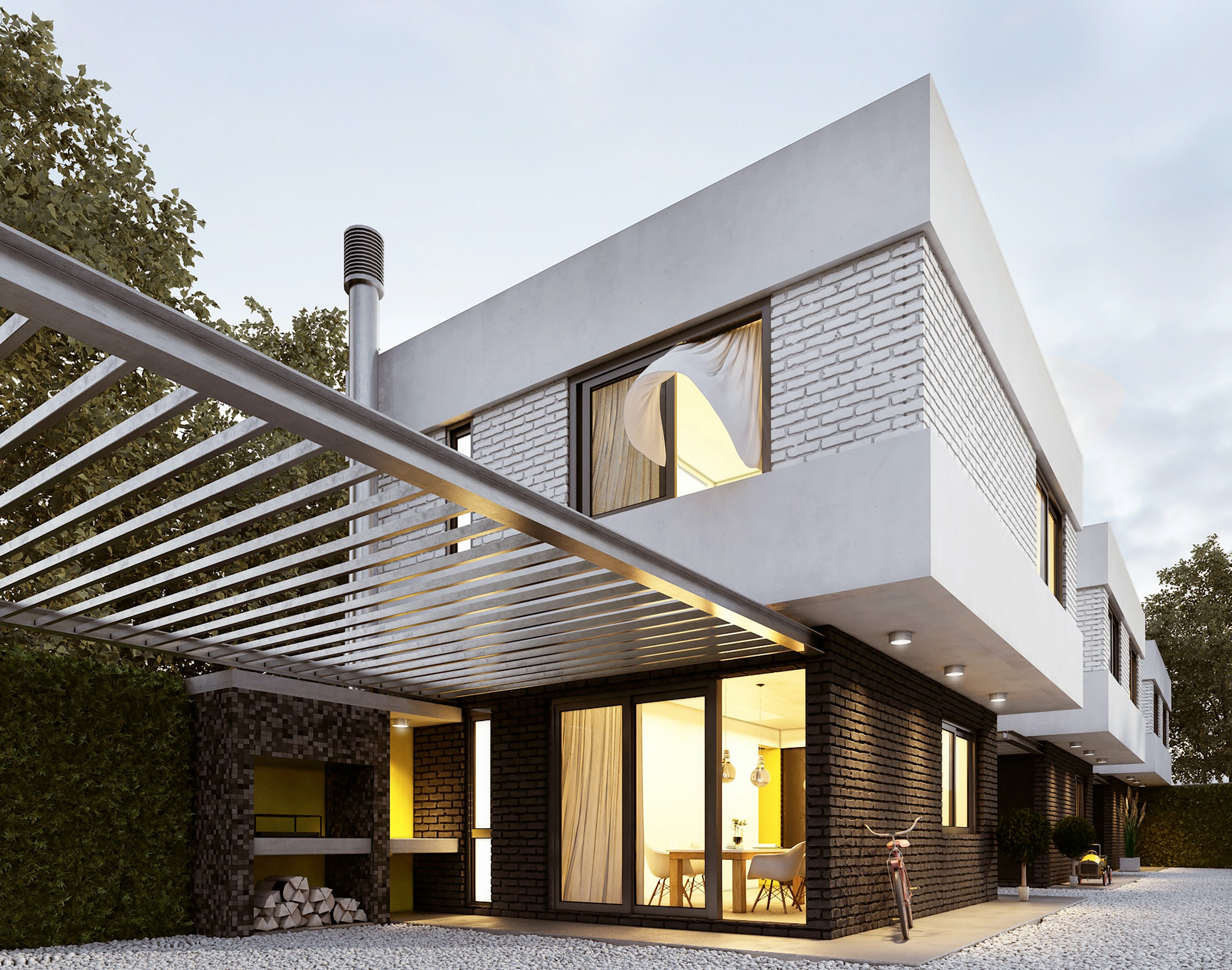 Modernes Einfamilienhaus mit beleuchteter Terrasse am Abend